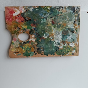 French vintage painter's palette, with oil paint splatters.