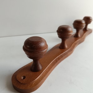 French vintage solid wood 4 peg coat rack with large domed pegs, circa 1970s.