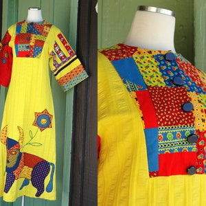 May include: A yellow patchwork dress with a colorful patchwork design on the bodice and sleeves. The dress has a bull applique on the front and a flower applique on the skirt.
