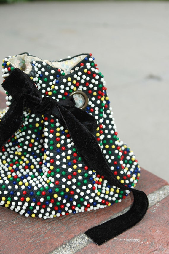 Late 1960's early 1970's black and white bead bag, fringe on bottom, cinch tie closure main image 1