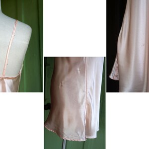 May include: A pale pink satin slip dress with thin straps. The dress has a simple, elegant design and is made of a soft, luxurious fabric.