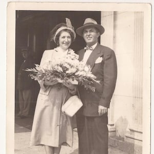 Sharp Dressed Man and Woman with a Massive Floral Array, Vintage Photograph, Black and White Photo, Vernacular Snapshot, Formal Dress
