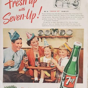 May include: Vintage advertisement for 7-Up featuring a family celebrating. The image shows a family of four, each holding a 7-Up bottle. The text reads "Fresh up with Seven-Up!" and "You like it... it likes you!"