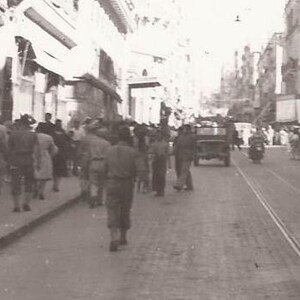 City Street Scene, Military Vehicles, Soldiers, Vintage Photograph, Black and White Photo, Buildings, Crowds of People on the Street