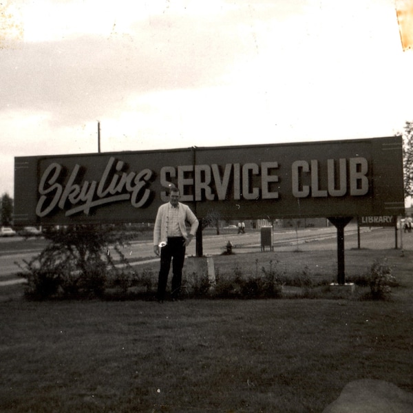 Skyline Service Club, Vintage Photograph, Black and White Image, Vernacular Photo, 1950's Photography, Man posing in front of a Large Sign