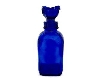 Vintage WYETH Eyewash Solution Bottle with Eye Cup Lid | Cobalt Blue Medicine Bottle | Pharmaceutical Advertising Collectible