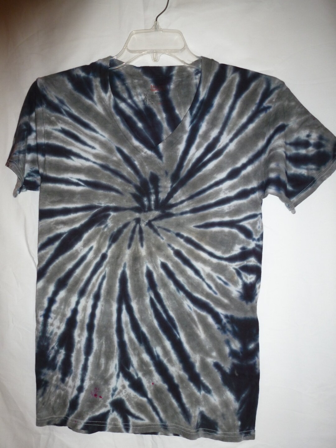 black tie dye on grey shirt