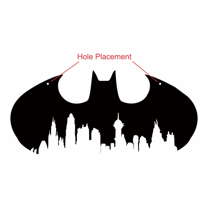 May include: A black Batman logo silhouette with a cityscape design at the bottom. The logo has two holes for hanging. The words "Hole Placement" are written in red, pointing to the holes.