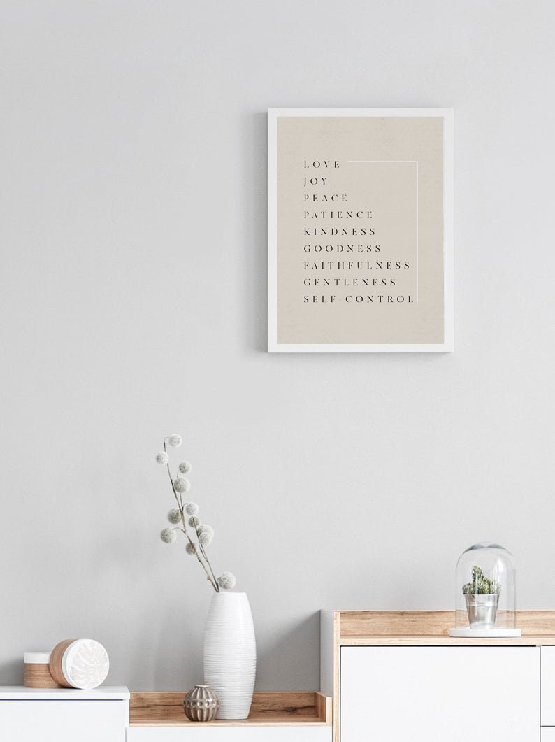 May include: A framed print with a beige background and black text. The text reads "Love, Joy, Peace, Patience, Kindness, Goodness, Faithfulness, Gentleness, Self Control".