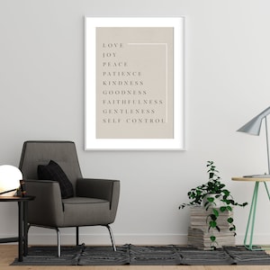 May include: A framed print with a beige background and black text. The text reads "Love, Joy, Peace, Patience, Kindness, Goodness, Faithfulness, Gentleness, Self Control."