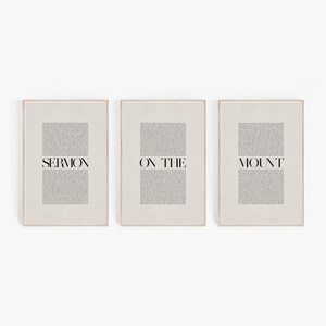 May include: Three beige framed prints with black text. The first print says "SERMON", the second print says "ON THE", and the third print says "MOUNT".