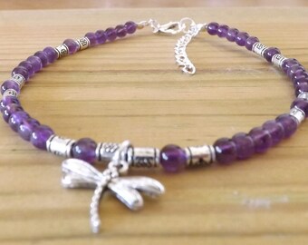 May include: Purple amethyst bead anklet with a silver dragonfly charm and silver spacer beads.