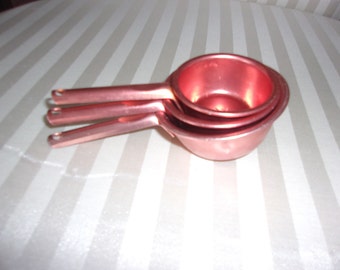 Measuring cups nesting copper plated
