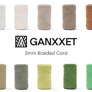 May include: Ten spools of 2mm braided cord in various colors, including white, beige, tan, brown, olive, green, yellow-green, and bright green. The brand name "GANXXET" is displayed above the text "2mm Braided Cord".
