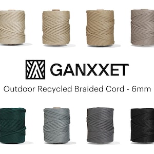 May include: A collection of 6mm thick braided cords in various colours, including natural, green, grey, and black. The cords are made from recycled materials and are labelled "GANXXET Outdoor Recycled Braided Cord - 6mm".