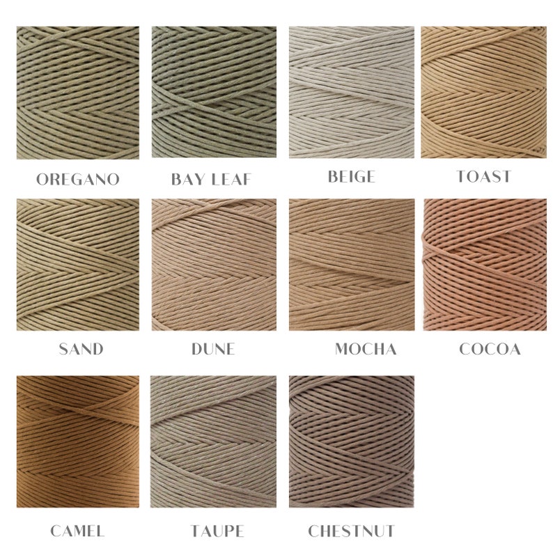 May include: Close-up of 12 spools of cotton cord in various shades of brown, beige, and green. The colors are labeled with names like "Oregano", "Bay Leaf", "Beige", "Toast", "Sand", "Dune", "Mocha", "Cocoa", "Camel", "Taupe", "Chestnut".