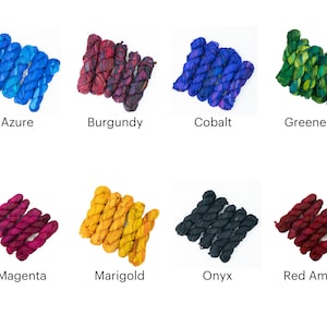 May include: Eight spools of colorful silk thread, each tied in a knot. The colors are azure, burgundy, cobalt, greenery, magenta, marigold, onyx, and red amber.