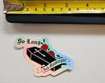May include: A holographic sticker with a black coffin, red roses, and the text "So Long And Goodnight".
