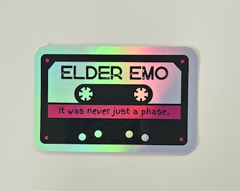 May include: A holographic sticker with a cassette tape design. The sticker has black text that reads "ELDER EMO" and "It was never just a phase."