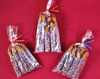 Crunchy Pretzel Rod Pieces covered in Chocolatey Goodness & colorful Nonpareils. (Includes 8 Pieces per bag)