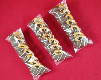 Gluten-Free Pretzel Twists drenched in Caramel & dipped in Milk Chocolatey Goodness. (Includes 7 per bag)