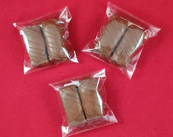 Crunchy Peanut Butter Wafers drenched in Caramel and dipped in Milk Chocolatey Goodness. (Includes 2 per bag)