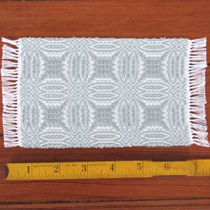 Handmade, Handcrafted 1:12 Scale Dollhouse Miniature Rug, Artisan Hand Woven Jade Green Carpet for Traditional Country Farmhouse or Modern Coastal Beach Cottage Decor is a perfect Doll House Furniture Accessory for your Miniature Bedroom or Living Room! Shown with ruler for scale.