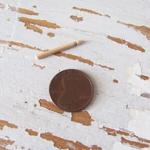 Inch to Foot Scale 1:12 Miniature Dollhouse Wood Crochet Hook Yarn Needle, Roombox Model Collector Textile Fiber Artist Handspinner Gift. Shown with penny coin for scale.