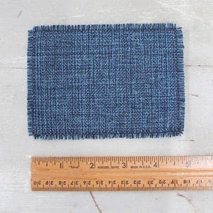 Inch to Foot Dollhouse Miniature Rug, 1:12 Scale Woven Small Indigo Navy Blue and Light Blue Floor Carpet for Modern Coastal Seaside Cottage or Traditional Rustic Nautical Beach Doll House. Shown with a ruler for scale.