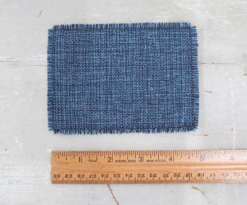 Inch to Foot Dollhouse Miniature Rug, 1:12 Scale Woven Small Indigo Navy Blue and Light Blue Floor Carpet for Modern Coastal Seaside Cottage or Traditional Rustic Nautical Beach Doll House. Shown with a ruler for scale.