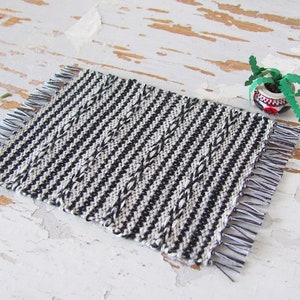 Handmade Inch to Foot Dollhouse Miniature Rug or Carpet,  1:12 Scale Artisan Hand Woven Black and Off-White Stripe and Diamond Pattern Scandinavian Modern, Rustic Farmhouse, Beach Cottage, or Southwest Desert Ranch Collector Dolls House Furniture Accessory Textile. Styled with a potted cactus.