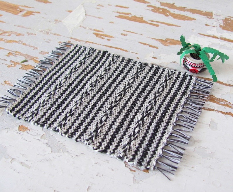 Handmade Inch to Foot Dollhouse Miniature Rug or Carpet,  1:12 Scale Artisan Hand Woven Black and Off-White Stripe and Diamond Pattern Scandinavian Modern, Rustic Farmhouse, Beach Cottage, or Southwest Desert Ranch Collector Dolls House Furniture Accessory Textile. Styled with a potted cactus.