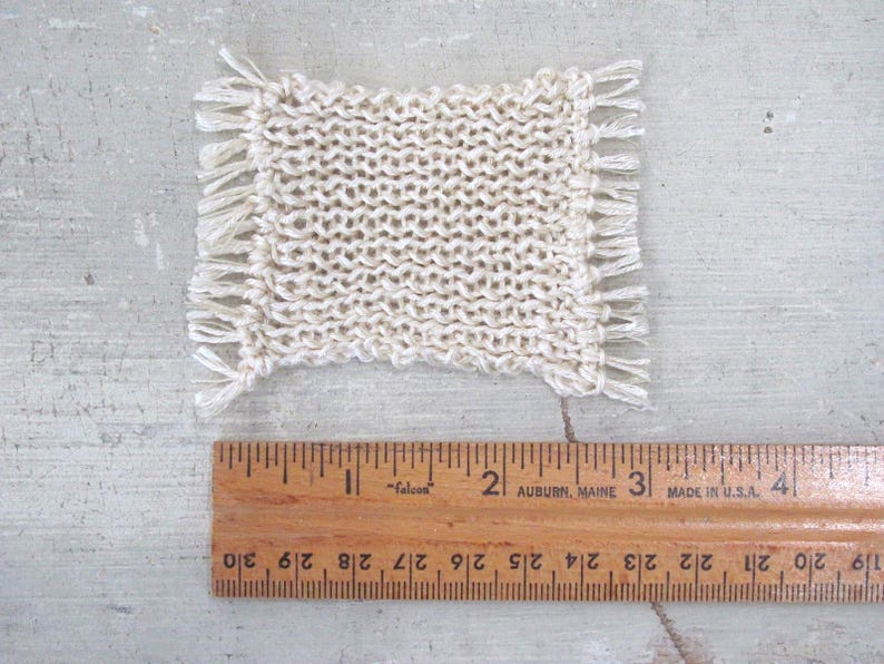 Little Handmade Half Inch to Foot Dollhouse Bed Throw Blanket, 1:24 Scale Miniature Artisan Hand Knit Ivory Cream White Bedspread, Doll House Furniture Bedroom Bedding, Collector Model Home Decor Accent Textile for Traditional Style or Modern Country Farmhouse, Cabin, or Cottage. Shown with ruler for scale.