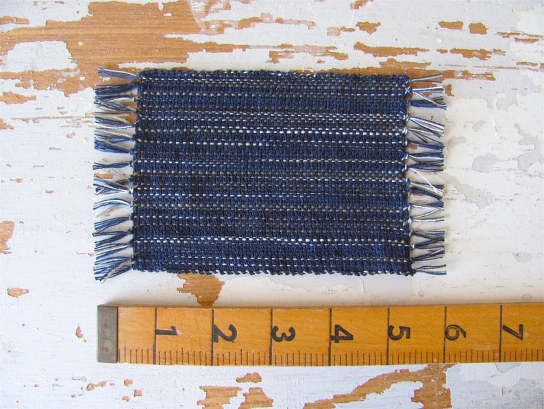 Handcrafted, Inch to Foot Dollhouse Miniature Rug is 1:12 Scale Artisan Hand Loom Woven in Indigo Navy Ocean Blue, Beige, and White Stripe Floor Carpet for Modern Coastal Seaside Nautical Beach House, Cabin Decor Doll House Furniture Accessory. Shown with ruler for scale.