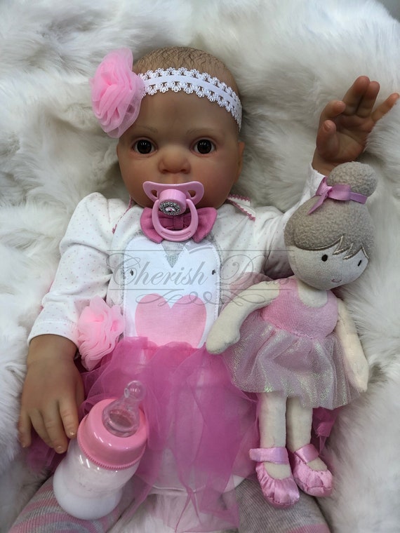 bébé reborn tellement vrai