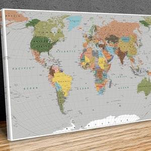 May include: A detailed world map with country borders outlined in colour. The map is printed on a white background with a grey grid pattern. The oceans are blue, and the continents are coloured in various shades of brown, green, yellow, and orange.