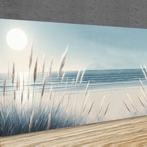 May include: A painting depicting a beach scene with tall grasses in the foreground and a blue ocean in the background. The sun is shining brightly in the sky.