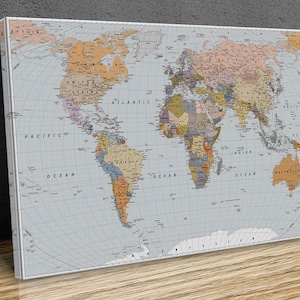 May include: A vintage-style world map with a light blue background and brown, orange, and yellow country borders. The map includes the names of oceans and continents.