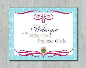 May include: A blue and white patterned sign with a pink swirl design. The sign says "Welcome to the Nite Owl Pajama Club" with a colorful owl illustration.