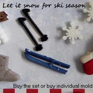 May include: Assortment of winter-themed molds, including skis, ski poles, snowflakes, a ski boot, a hat, and mittens. The text "Let it snow for ski season" is displayed at the top.