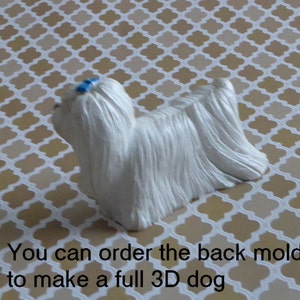 May include: A white dog figurine with long, flowing fur and a small blue bow. The figurine is on a patterned surface. Text on the image reads: "You can order the back mold to make a full 3D dog."