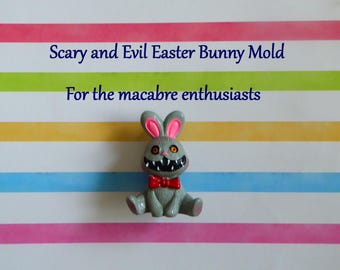 May include: A gray Easter bunny mold with pink inner ears, a red bow tie, and a menacing grin. The text on the image reads "Scary and Evil Easter Bunny Mold" and "For the macabre enthusiasts".