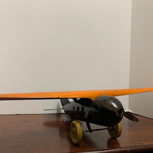 1930s Wyandotte Pressed Metal Orange Plane image 1