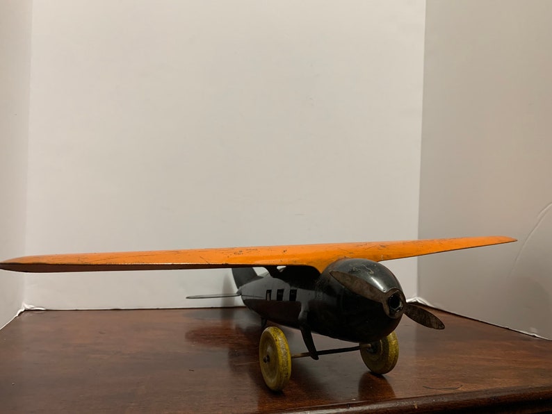 1930s Wyandotte Pressed Metal Orange Plane image 1