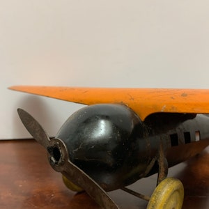 1930s Wyandotte Pressed Metal Orange Plane image 5