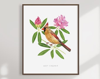 以下が含まれることがあります： ピンクのシャクナゲの花が咲いた枝に止まっている、赤い鳥のカーディナルを描いた水彩画。絵は額装されており、下部に「WEST VIRGINIA」の文字が書かれている。
