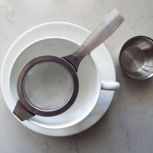 Vintage Tea Strainer and Drip Bowl 1960s. Stainless Steel Loose Leaf Tea Infuser. Mid-Century Retro Tea Strainer For An Afternoon Tea Party