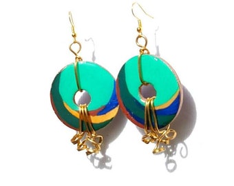 May include: A pair of green, blue, and gold painted wooden earrings with gold wire accents and dangling gold charms.