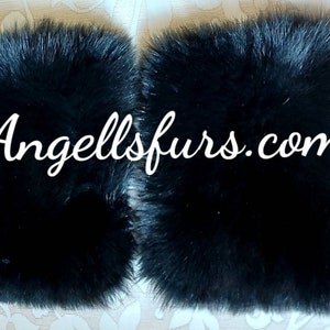 May include: Two black faux fur squares with the text "Angellsfurs.com" in the center.