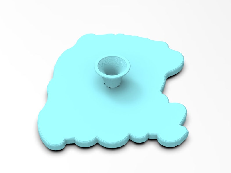 May include: A light blue silicone mold shaped like a cloud with a small, round, light blue indentation in the center.
